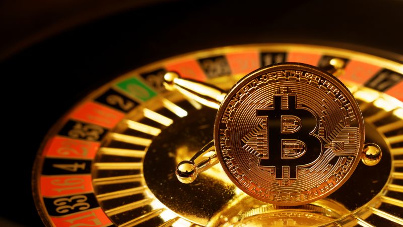 How can you earn Bitcoin through gaming?